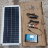 Flexible 150W solar panel with dual USB ports, ideal for outdoor adventures and car battery charging.